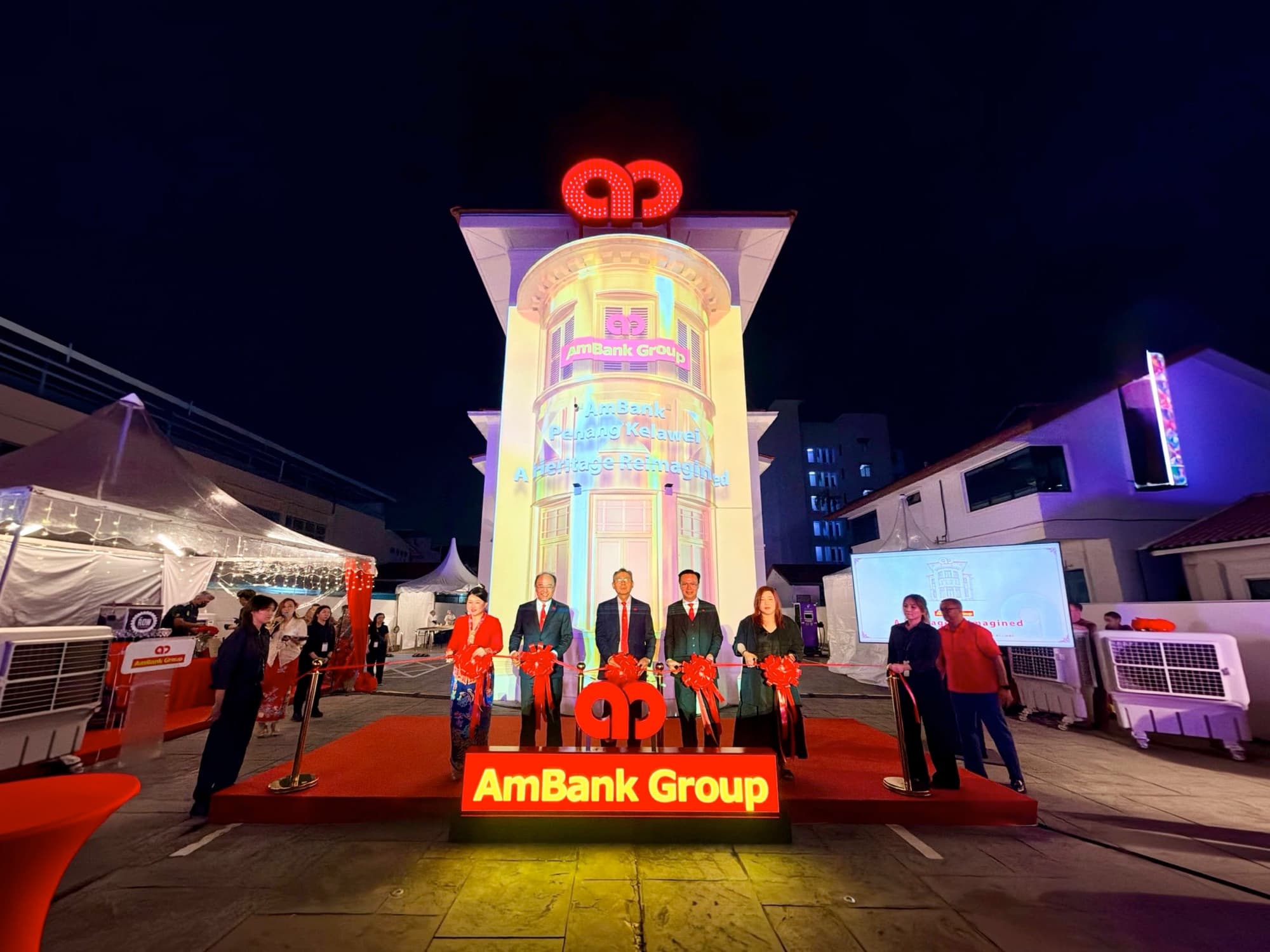 The AmBank Jalan Kelawei heritage bungalow lit up at night for its grand launch